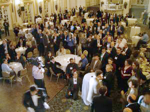 View from balcony of audience standing and taking photos