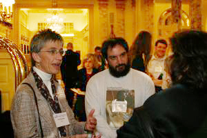 Attendees talking outside the ballroom